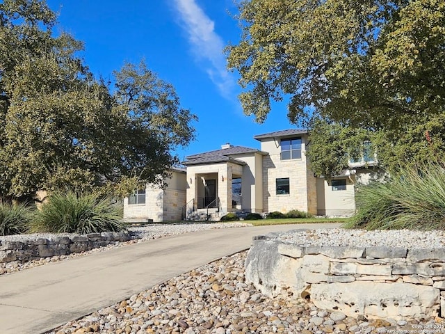 5922 Keller Rdg, New Braunfels, TX 78132 - view of front of home with stone siding, stucco siding, and a chimney