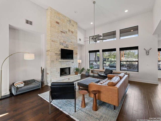 5922 Keller Rdg, New Braunfels, TX 78132 - living area featuring hardwood / wood-style floors, ceiling fan, a fireplace, a high ceiling, and recessed lighting