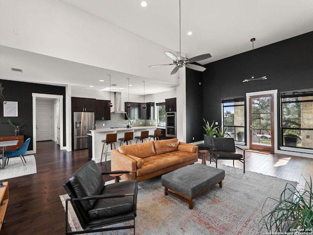 5922 Keller Rdg, New Braunfels, TX 78132 - living area featuring dark wood-style floors, recessed lighting, a ceiling fan, and a high ceiling