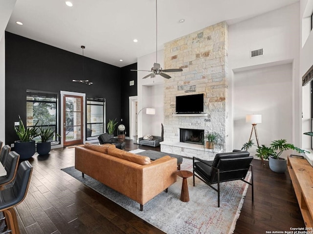 5922 Keller Rdg, New Braunfels, TX 78132 - living area with a towering ceiling, a ceiling fan, a fireplace, wood finished floors, and recessed lighting