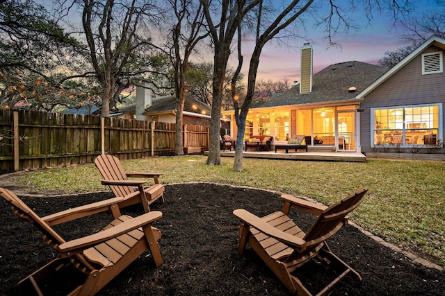 view of yard featuring fence and a patio