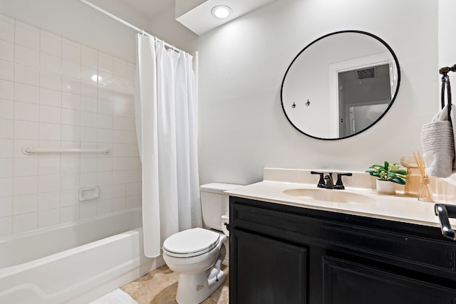 bathroom featuring toilet, visible vents, shower / bath combo with shower curtain, and vanity