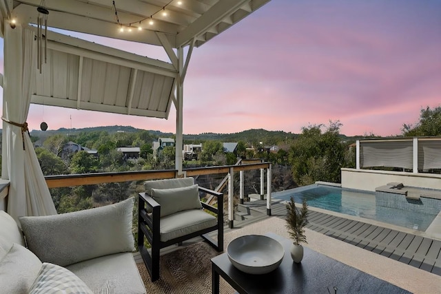 exterior space featuring an outdoor living space and an outdoor pool