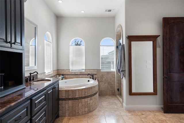 full bathroom with a garden tub, recessed lighting, visible vents, vanity, and tile patterned floors