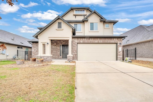 craftsman-style house featuring driveway, brick siding, fence, and stucco siding