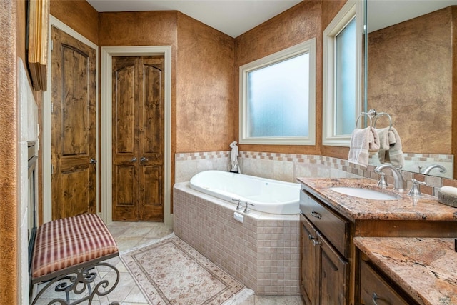 bathroom with a bath and vanity