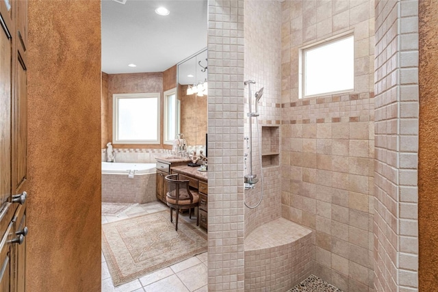 full bathroom featuring tile patterned floors, a walk in shower, vanity, and a bath
