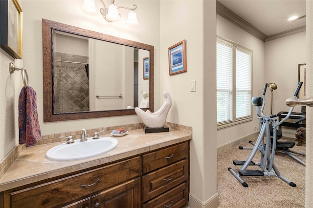 bathroom with baseboards, curtained shower, ornamental molding, and vanity