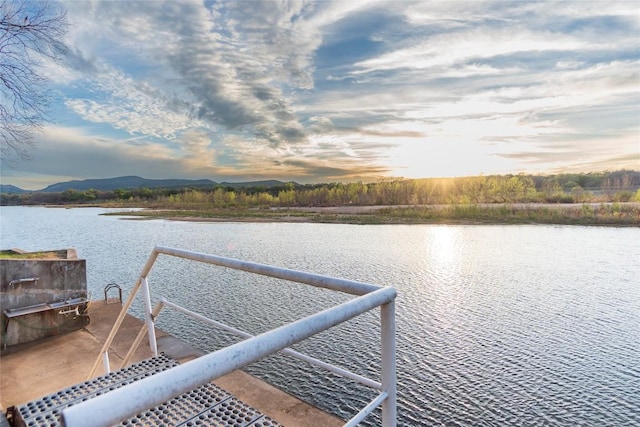 dock area with a water and mountain view