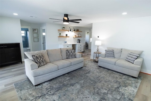 living area featuring light wood finished floors, recessed lighting, visible vents, ceiling fan, and baseboards