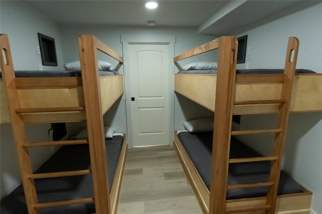 bedroom with recessed lighting and light wood-style flooring