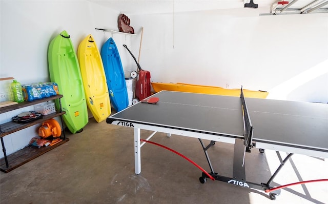 game room with concrete floors