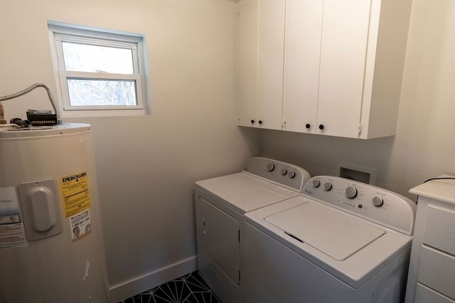 laundry area with washer and dryer, water heater, cabinet space, and baseboards