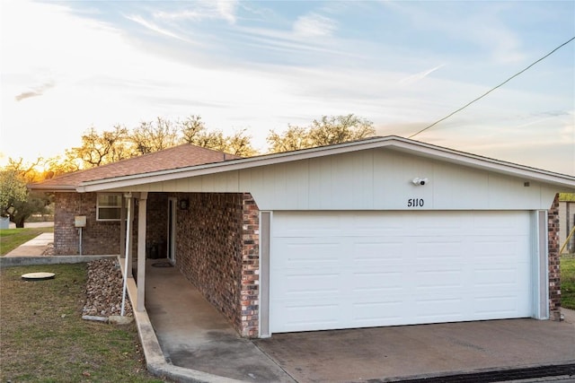 ranch-style house featuring brick siding and an attached garage