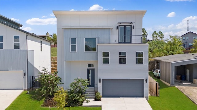 view of front of house with concrete driveway, an attached garage, board and batten siding, a balcony, and a front lawn