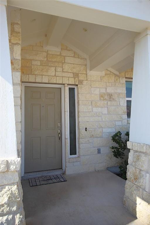 116 Four Star Dr, Elgin, TX 78621 - doorway to property featuring stone siding