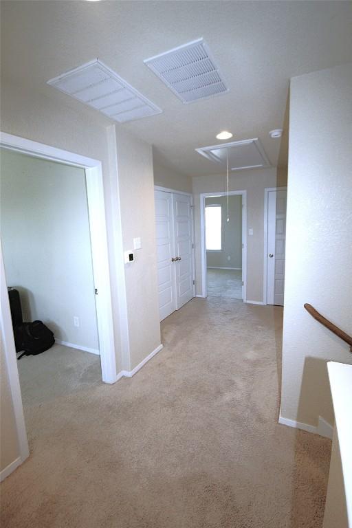 116 Four Star Dr, Elgin, TX 78621 - hallway with attic access and carpet flooring