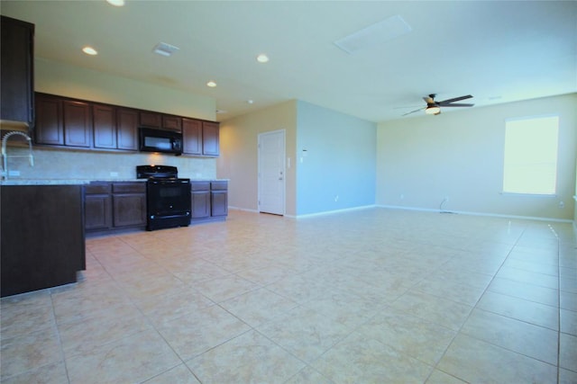 116 Four Star Dr, Elgin, TX 78621 - kitchen featuring black appliances, tasteful backsplash, recessed lighting, light tile patterned flooring, and light countertops