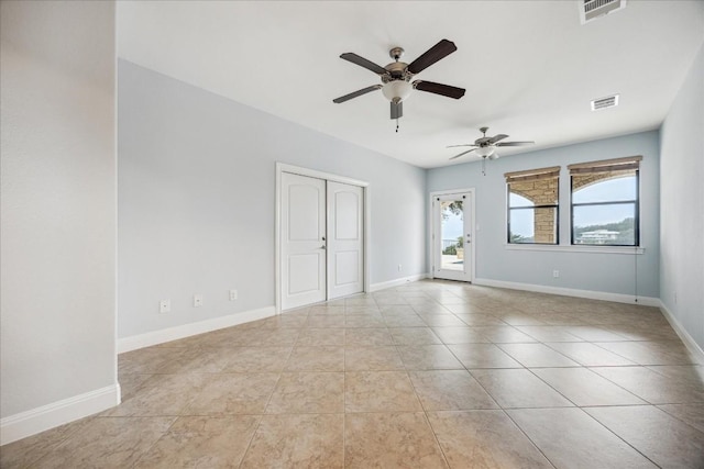17813 Kingfisher Ridge Dr, Lago Vista, TX 78645 - spare room with a ceiling fan, light tile patterned flooring, and baseboards