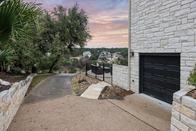 17813 Kingfisher Ridge Dr, Lago Vista, TX 78645 - yard at dusk with a gate