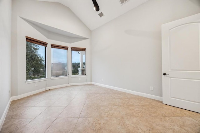 17813 Kingfisher Ridge Dr, Lago Vista, TX 78645 - tiled spare room featuring high vaulted ceiling and baseboards