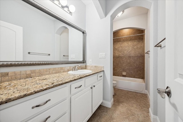 17813 Kingfisher Ridge Dr, Lago Vista, TX 78645 - bathroom with vanity, toilet, baseboards, and tile patterned floors