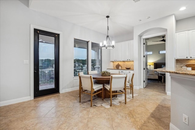 17813 Kingfisher Ridge Dr, Lago Vista, TX 78645 - dining area with a chandelier, a ceiling fan, recessed lighting, and baseboards