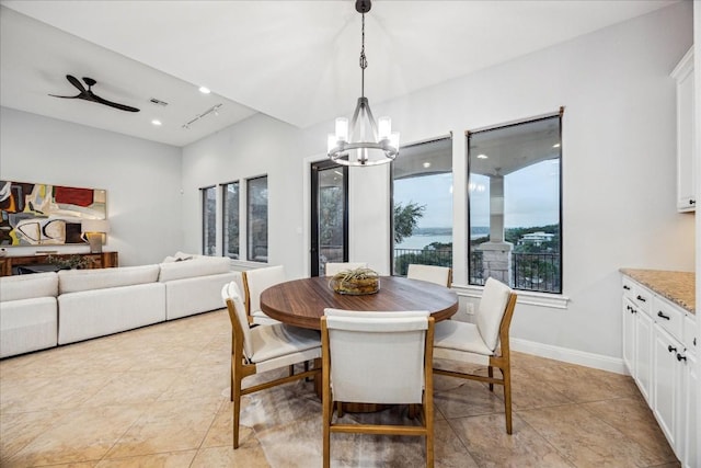 17813 Kingfisher Ridge Dr, Lago Vista, TX 78645 - dining area featuring a chandelier, light tile patterned flooring, baseboards, and a ceiling fan