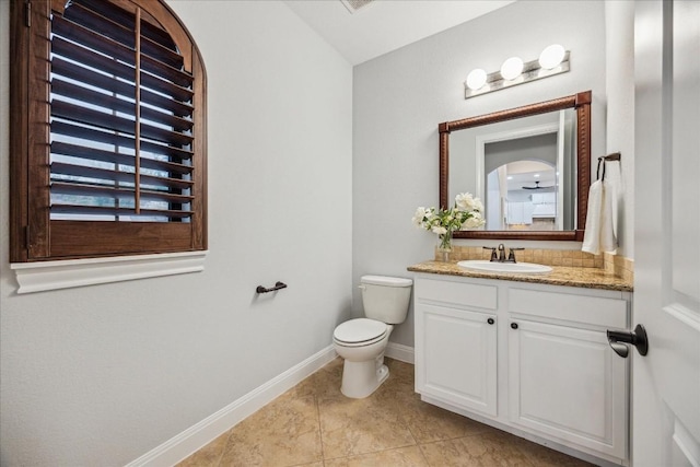 17813 Kingfisher Ridge Dr, Lago Vista, TX 78645 - half bathroom with vanity, toilet, baseboards, and tile patterned flooring