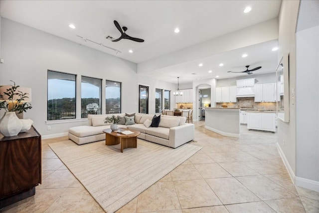 17813 Kingfisher Ridge Dr, Lago Vista, TX 78645 - living area featuring ceiling fan, arched walkways, recessed lighting, light tile patterned floors, and baseboards