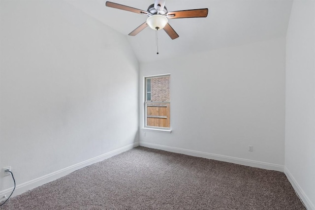 carpeted empty room featuring ceiling fan, baseboards, and vaulted ceiling