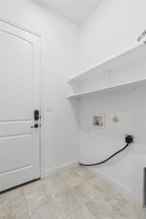 washroom with laundry area, gas dryer hookup, hookup for a washing machine, and baseboards