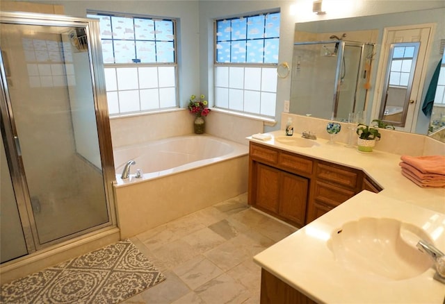 full bathroom with a bath, a shower stall, vanity, and a healthy amount of sunlight