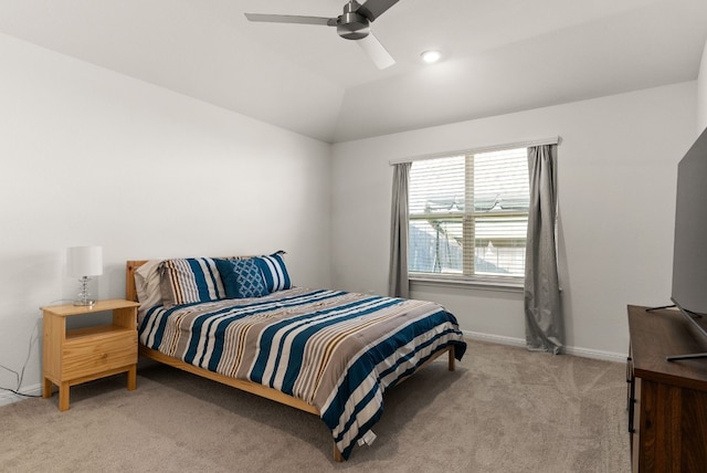 bedroom with vaulted ceiling, baseboards, a ceiling fan, and light colored carpet