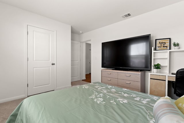 bedroom featuring light colored carpet, visible vents, and baseboards