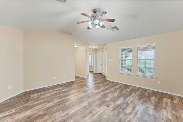 unfurnished living room with vaulted ceiling, ceiling fan, wood finished floors, and visible vents