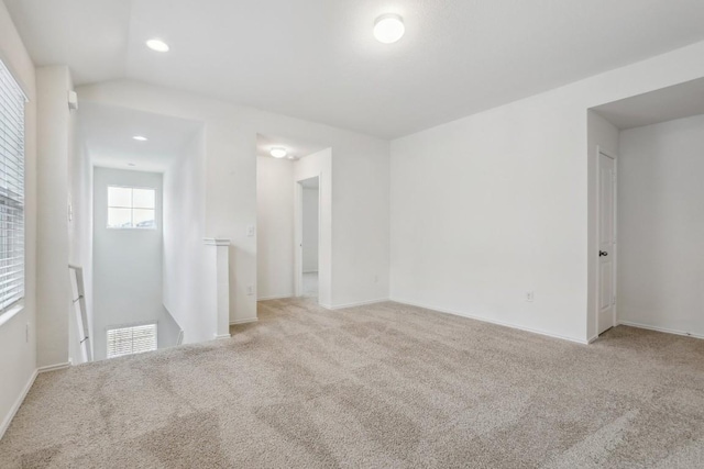 unfurnished room with recessed lighting, visible vents, and light carpet