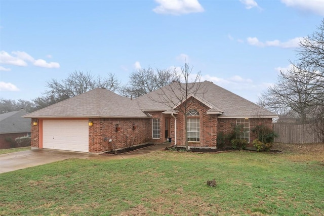 single story home with brick siding, a shingled roof, concrete driveway, an attached garage, and a front yard