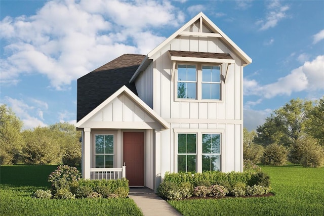 view of front of home featuring roof with shingles, board and batten siding, and a front lawn