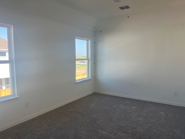 522 Ansley Ct, Taylor, TX 76574 - unfurnished room with dark carpet and baseboards