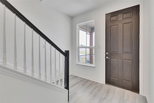 522 Ansley Ct, Taylor, TX 76574 - foyer entrance with stairway and wood finished floors