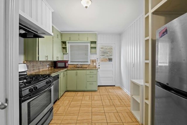 kitchen featuring stone counters, appliances with stainless steel finishes, backsplash, open shelves, and green cabinetry