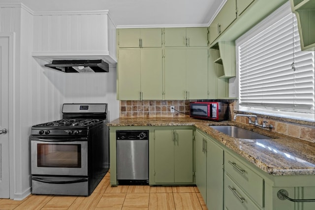 kitchen featuring light stone counters, a sink, stainless steel gas range, open shelves, and green cabinetry