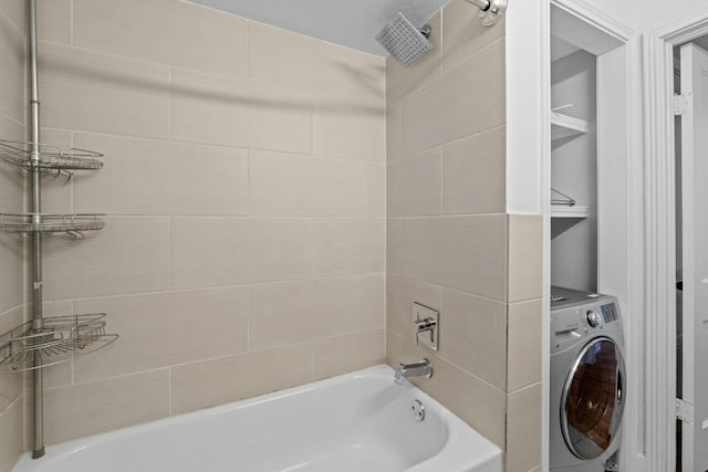 bathroom with washer / clothes dryer and shower / bathing tub combination