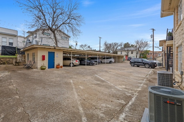 view of partially covered parking lot