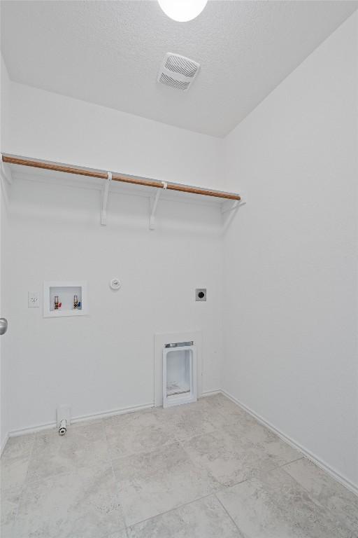 laundry area with gas dryer hookup, laundry area, hookup for a washing machine, and visible vents