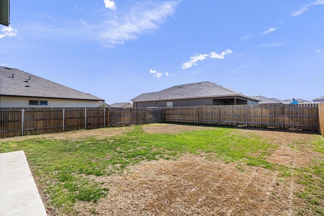 view of yard featuring a fenced backyard