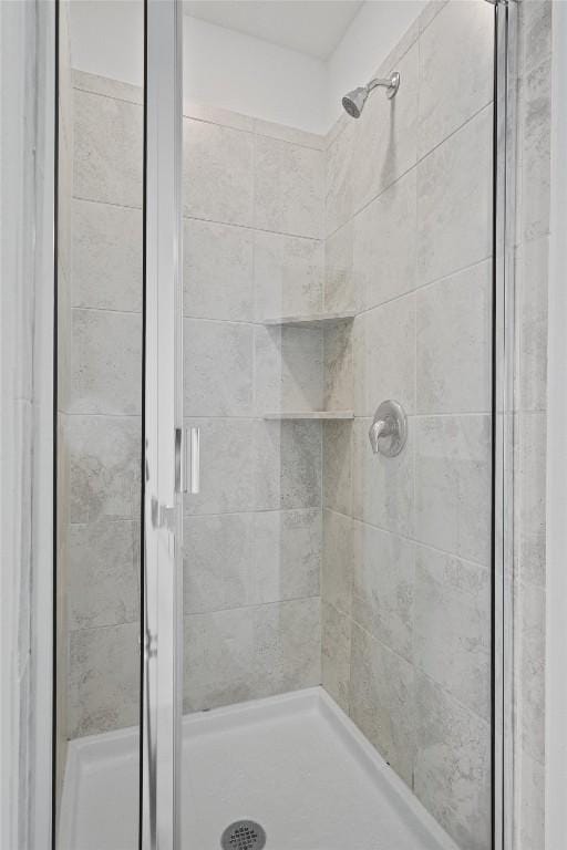 bathroom featuring a shower stall