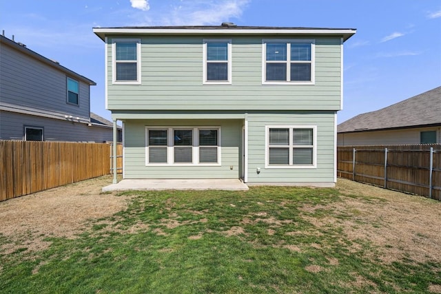 rear view of house featuring a patio area, a fenced backyard, and a yard