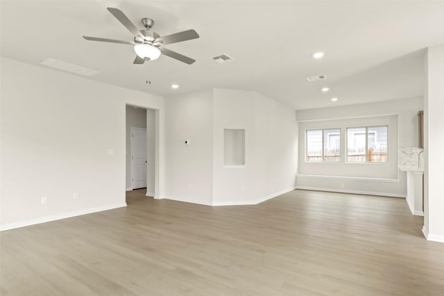 359 Witchhazel Way, San Marcos, TX 78666 - unfurnished living room with light wood finished floors, recessed lighting, a ceiling fan, and baseboards